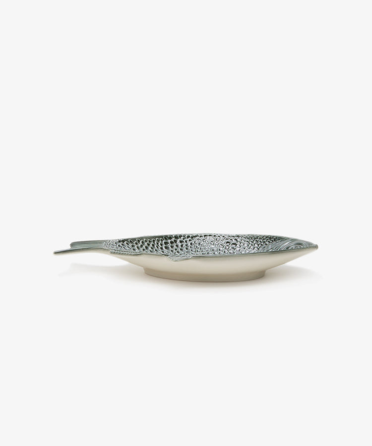 Peixe Platter. Glazed earthenware fish-shaped plate in green, side view.