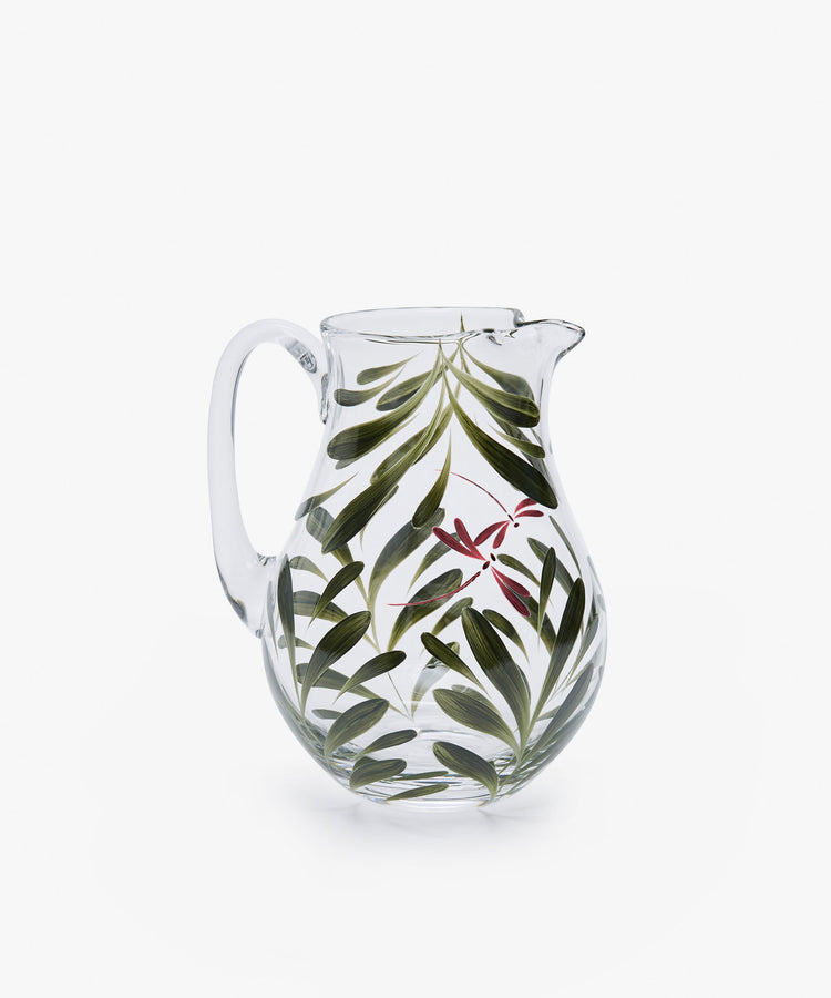 Dragonfly Jug. Transparent glass pitcher painted with green leaves and red dragonfly, back view