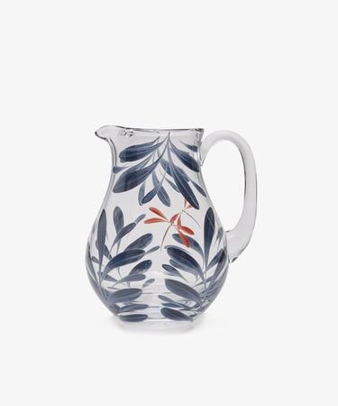 Dragonfly Jug by Los Vasos de Agua Clara. Transparent glass pitcher painted with blue-grey leaves and red dragonfly.
